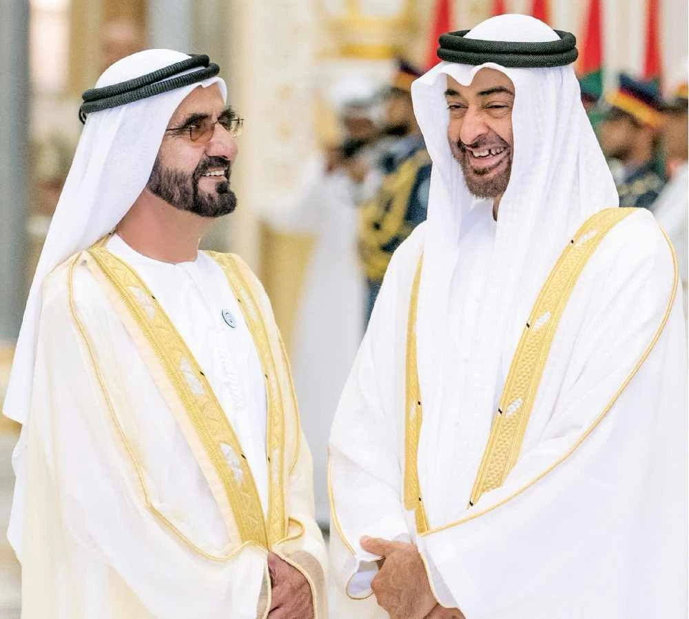 UAE Foreign Trade 2024: Remarkable Dh5.23 Trillion Growth! 11 two men wearing white robes and white headdresses