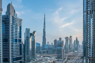 Dubai holding emaar stake times of dubai