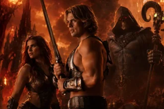 Masters of the universe fantasy feature image showing he man with a sword a female warrior and a dark skull faced villain in a fiery battlefield Times of dubai