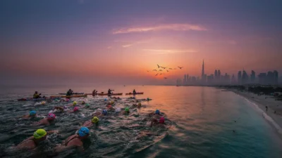 Dubai t100 triathlon weekend al mamzar november 2026 athletes swimming open water coastal times of dubai