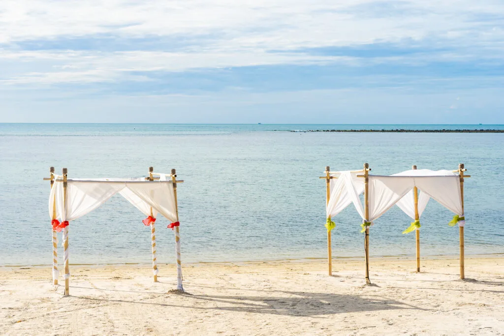 Beautiful outdoor tropical beach sea ocean with umbrella chair a - Times of Dubai Abu dhabi new beach opening times of dubai