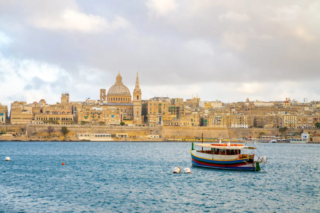 Beautiful sunset view of historic sites by the river in Valletta, Malta - Times of Dubai Best places to buy a vacation home in 2025 times of dubai
