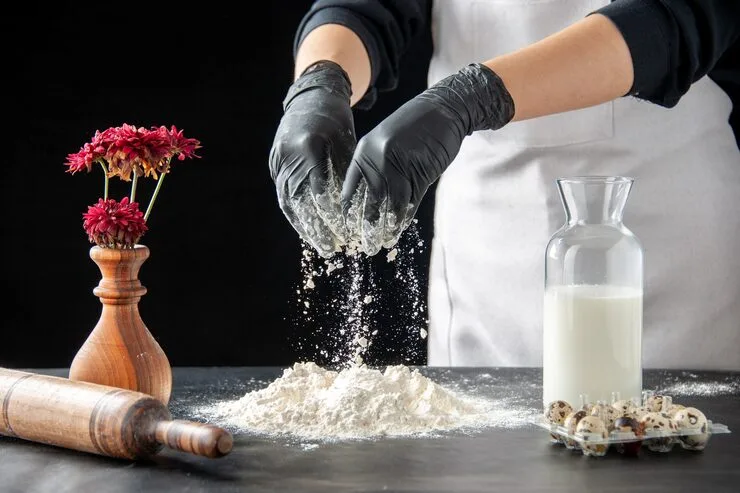 front-view-female-cook-pouring-white-flour-table-dough-dark-job-pastry-pie-bakery-cooking-dough-bake-cake-biscuit_179666-43905 - Times of Dubai Best european restaurants in dubai times of dubai