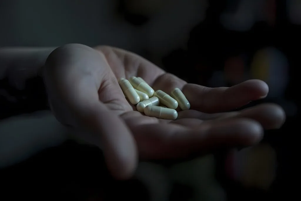 hand-with-medication-dark-style (1) - Times of Dubai National anti narcotics authority in uae 2025 to dismantle supply and abuse of drugs times of dubai