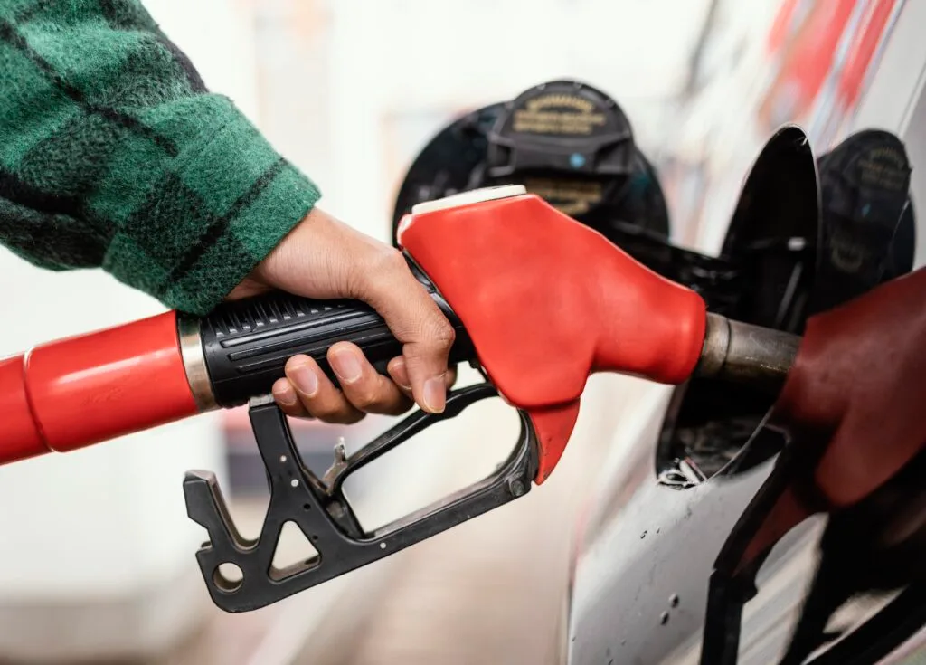 man-gas-station-with-car-close-up - Times of Dubai Uae petrol prices in september times of dubai