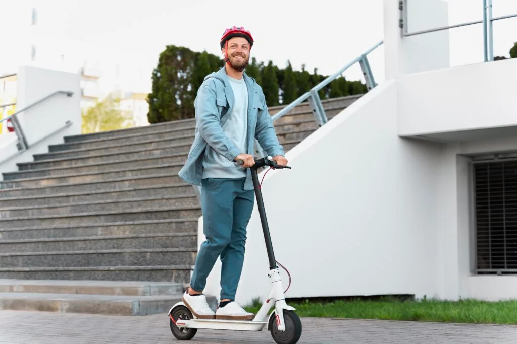 man-riding-eco-scooter-city - Times of Dubai Ajman e scooter ban a tough call but safety must come first said families times of dubai
