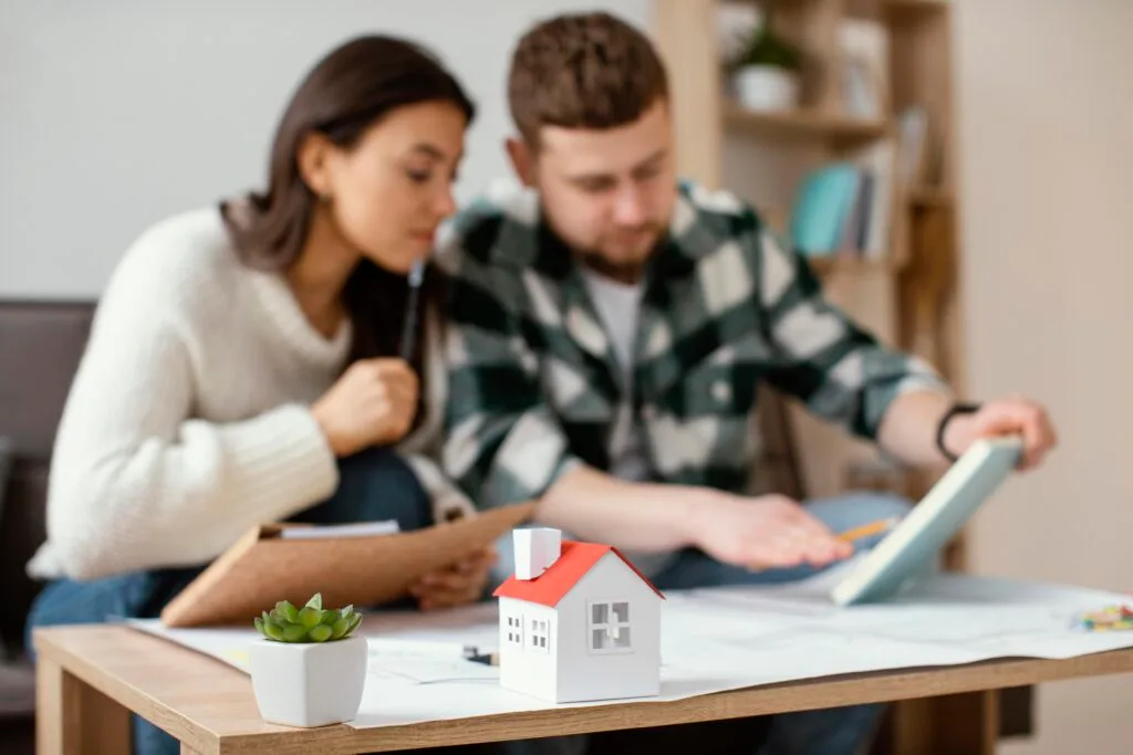 medium-shot-blurry-couple-indoors - Times of Dubai Dubai first time home buyers discount developers offer special rates times of dubai