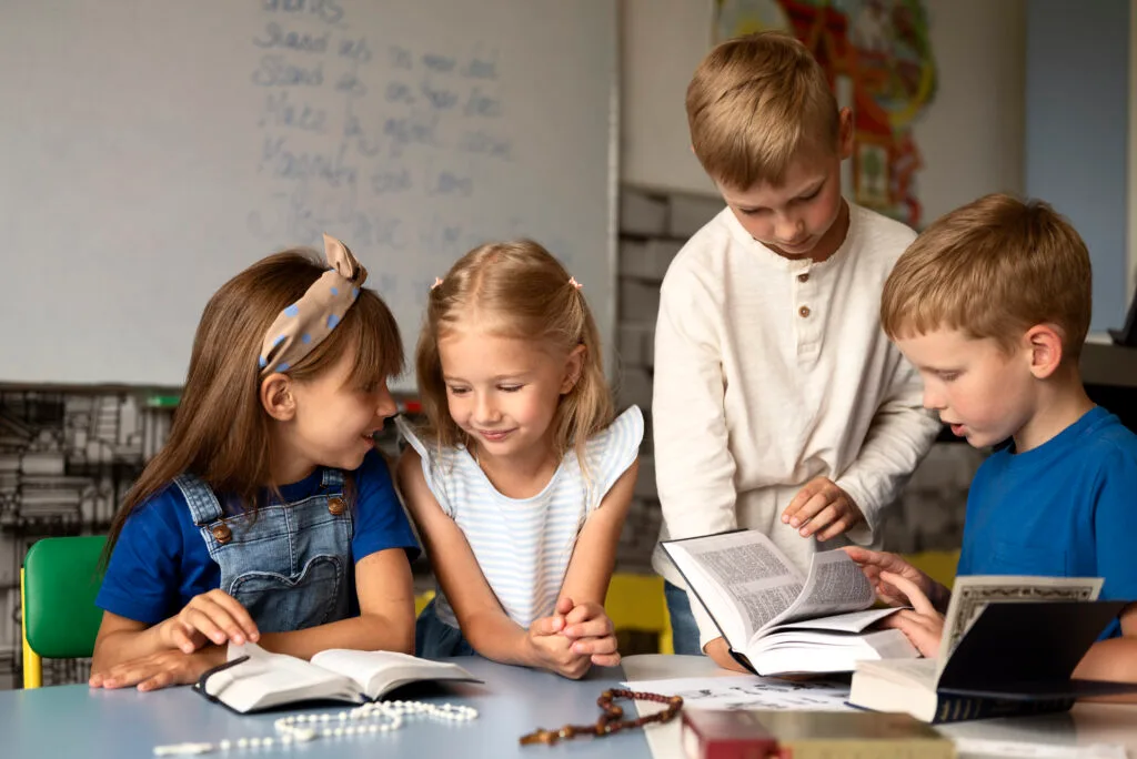 medium-shot-little-kids-studying-bible - Times of Dubai New schools in dubai reshaping the dubai academic year 2025 26 times of dubai