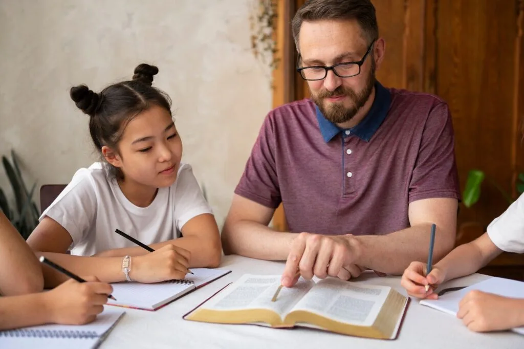 medium-shot-man-teaching-bible_23-2149547973 - Times of Dubai Uae flexible work hours for parents relief for families times of dubai
