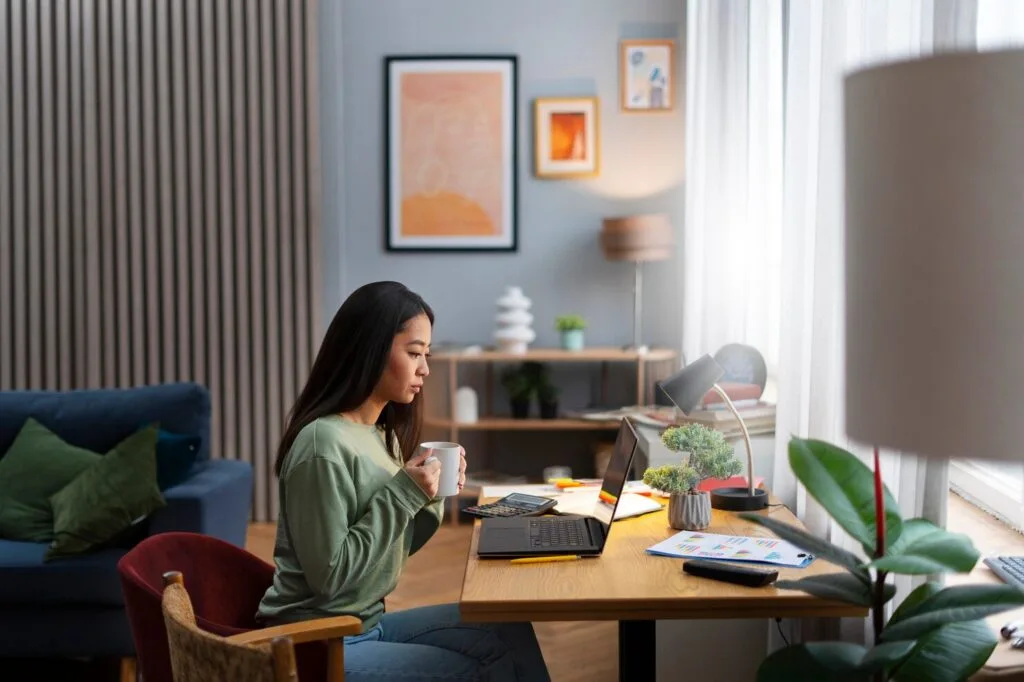 medium-shot-woman-working-from-home_23-2150232428 - Times of Dubai Top countries for remote work in 2025 where uae digital nomads can thrive times of dubai