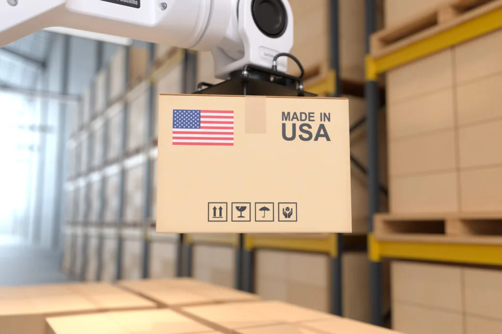 The Robot arm picks up the cardboard box Made in USA, Automation - Times of Dubai Us tariff on small packages times of dubai