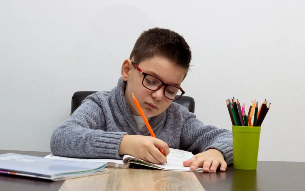 seven-years-old-child-writing-home-boy-studying-table-kid-drawing-with-pencil_1212-901 - Times of Dubai Uae academic year 2025 26 brings major changes in testing and language education times of dubai