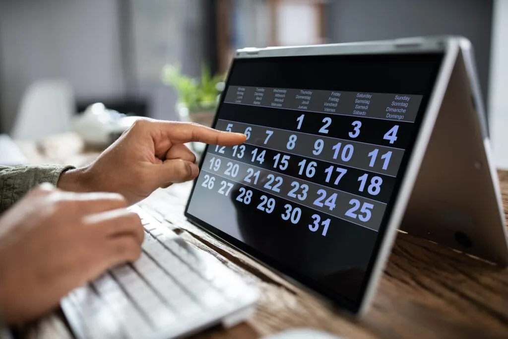 Close-up,Of,A,Businessman,Looking,At,Calendar,With,Daily,Agenda - Times of Dubai Uae public holiday 2026 best long weekend planner for the year times of dubai