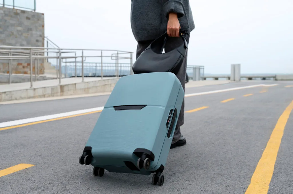 side-view-traveler-with-suitcase - Times of Dubai Uae airline lost luggage issues legal steps every traveler should know times of dubai