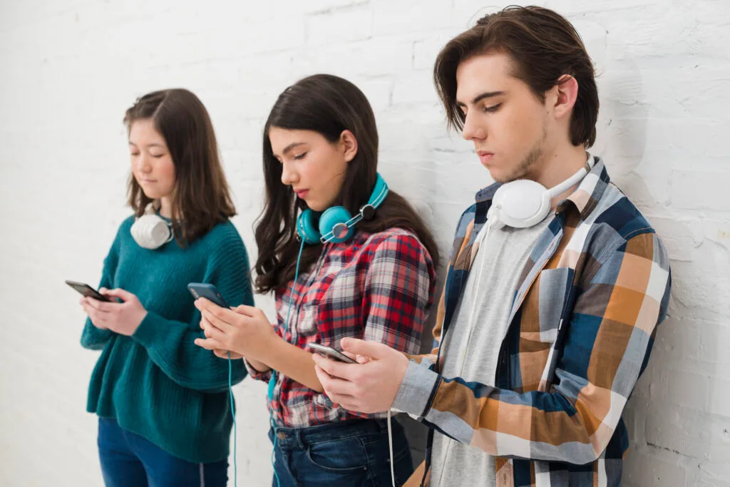 teenagers-using-smartphone - Times of Dubai Iphone 17 vs Budget options best affordable phones for teens times of dubai
