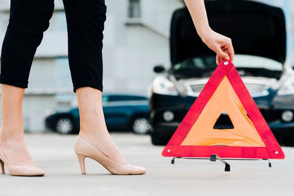 woman-placing-emergency-sign_23-2148257990 - Times of Dubai Dubai police ai traffic fines enforce stricter penalties for 8 key offences times of dubai